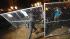Occupy Oakland protester tears down a fence