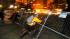Occupy Oakland protester tears down a fence