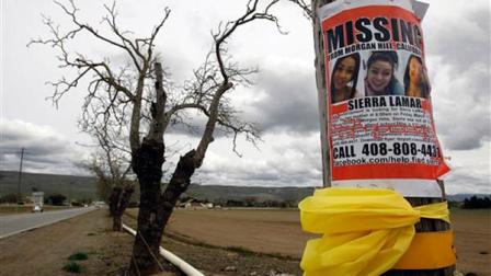 A missing person poster depicting Sierra LaMar is posted at the intersection of Dougherty and Palm Avenues Monday, March 26, 2012, in Morgan Hill, Calif. This was the intersection where LaMar missed her bus to Sobrato High School on March 16.