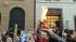 Occupy protesters mark anniversary with marches :: An Occupy protester burns cash during a demonstration in San Francisco.