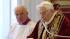 Pope Benedict XVI to resign Feb. 28 :: In this photo provided by the Vatican newspaper LOsservatore Romano, Mons. Franco Comaldo, left, a pope aide, looks at Pope Benedict XVI as he reads a document in Latin where he announces his resignation.