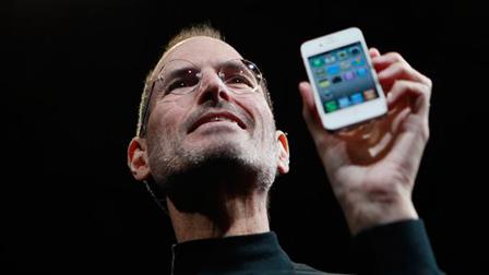 Apple CEO Steve Jobs holds the new iPhone 4 at the Apple Worldwide Developers Conference.