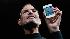 Apple CEO Steve Jobs holds the new iPhone 4 at...