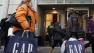 Shoppers are photographed on 34th Street, in New York