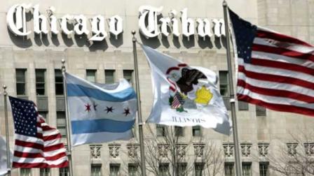 Flags wave along Michigan Ave. Bridge outside the Chicago Tribune Tower in Chicago in this, April 12, 2006, file photo.