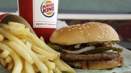 FILE - In this Oct. 26, 2009 photo, a Burger King Whopper sandwich and fries are shown at a Burger King in Allison Park, Pa. (AP Photo/Gene J. Puskar)