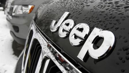 The Chrysler Jeep logo is displayed on 2012 Jeep Grand Cherokee on the lot of Willie Racines Jeep on Tuesday, Jan. 31, 2012 in South Burlington, Vt.