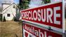 ** FILE ** A foreclosure sign is seen on the lawn of a home in Egg Harbor Township, N.J., in this March 15, 2008 file photo. (AP Photo/Mel Evans, file)