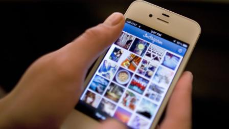 In this Monday, April 9, 2012, file photo, Instagram is demonstrated on an iPhone, in New York. (AP Photo/Karly Domb Sadof, File)