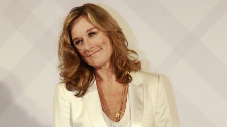 CEO of Burberry, the iconic British luxury brand, Angela Ahrendts poses for media as she arrives at a party for the opening of Burberrys flagship store outside the Taipei 101 building in Taipei, Taiwan, Thursday, April 26, 2011. (AP Photo/Wally Santana)