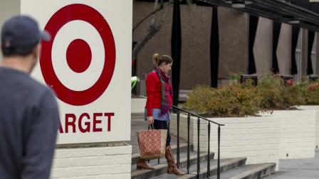 Shoppers walk past a Target store in Pasadena, Calif., on Thursday, Dec. 19, 2013. Target says that about 40 million credit and debit card accounts may have been affected by a data breach that occurred just as the holiday shopping season shifted into high gear. (AP Photo/Damian Dovarganes)