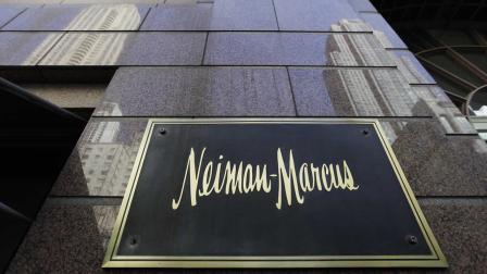 The Chicago skyline is reflected in the exterior of Neiman Marcus on Michigan Ave. Wednesday, March 11, 2009, in Chicago.(AP Photo/M. Spencer Green)