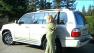 Woman points to the roof rack on her Lexus