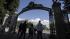 A group as they walk through the Sather Gate on the University of California, Berkeley campus in Berkeley, Calif.