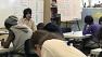 Teacher and students in a classroom in Oakland