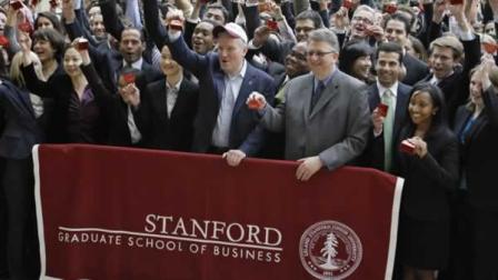 New York Stock Exchange CEO Duncan Niederauer, with hat, and Garth Saloner, Dean of the Stanford Graduate School of Business, to his right, ring the closing NYSE bell, via video teleconference, with hundreds of other Stanford MBA students on the Stanford University campus in Palo Alto, Calif., Thursday, Dec. 2, 2010. (AP Photo/Paul Sakuma)