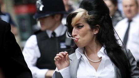 British singer Amy Winehouse arrives at Westminster magistrates court in London, Friday, July 24, 2009. The singer faces a charge of assault. (AP Photo/Kirsty Wigglesworth)