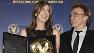 Director Kathryn Bigelow, left, poses with her feature film award along with director Danny Boyle.