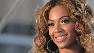 Beyonce Knowles posing for pictures at a press conference in New York.