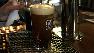 A beer is poured at a bar.