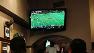 People watch the New Orleans Saints play against the Indianapolis Colts during televised broadcasting of the NFL Super Bowl XLIV football game.