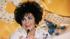 Actress Elizabeth Taylor, holding her dog Sugar,...