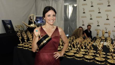 Actress Julia Louis-Dreyfus, winner of the Emmy for Outstanding Lead Actress in a Comedy Series for Veep, poses backstage at the 64th Primetime Emmy Awards at the Nokia Theatre on Sunday, Sept. 23, 2012, in Los Angeles. (Photo by Matt Sayles/Invision/AP)
