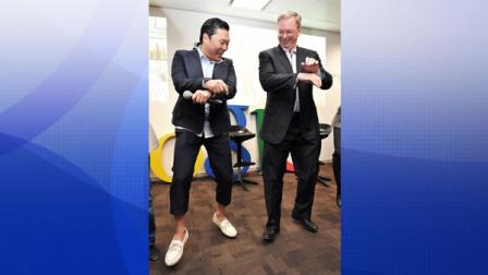South Korean rapper PSY, who sings the popular Gangnam Style song, teaches Google Executive Chairman Eric Schmidt, right, his signature horse dance during their meeting at Google Korea headquarters in Seoul, South Korea, Thursday, Sept. 27, 2012.
