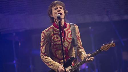 Mick Jagger of British band the Rolling Stones performs on the Pyramid main stage at Glastonbury, England, Saturday, June 29, 2013