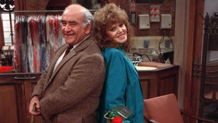 Actor Ed Asner and actress Eileen Brennan pose back to back on the set of the television pilot Off the Rack in Los Angeles, Ca., March 15, 1984.