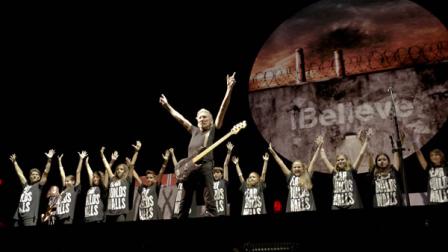 Roger Waters performs along with a group of Romanian children during his The Wall Live show in Bucharest, Romania.