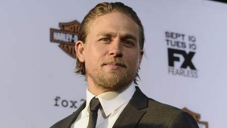 Actor Charlie Hunnam arrives on the red carpet at the season six premiere screening of the television series Sons of Anarchy at the Dolby Theatre on Saturday, Sept. 7, 2013 in Los Angeles. (Photo by Dan Steinberg/Invision/AP)