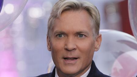 This Oct. 17, 2012 photo shows Sam Champion, the weather anchor of ABCs Good Morning America program in New Yorks Times Square. Weather Channel President David Clark announced Monday, Dec. 2, 2013, that Champion will anchor the networks new flagship morning show, which is set to debut in early 2014. Champion, who will be based at the Weather Channel headquarters in Atlanta, will also assume managing editor responsibilities at the network. His last day on GMA is Wednesday. He had been on that program since 2006. He joined local New York station WABC in 1988. (AP Photo/Richard Drew)