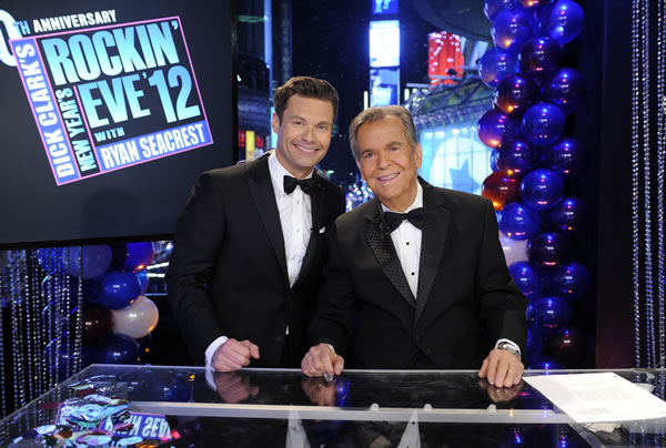 In this Dec. 31, 2011 photo released by ABC, hosts Dick Clark, right, and Ryan Seacrest pose on the set of 