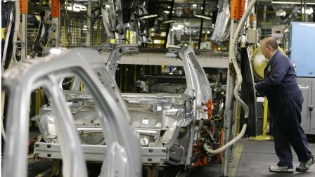 **FILE** Ford Motor Company employee Ralph Gazzillo assembles the new 2008 Ford Taurus X, in this June 22, 2007 file photo after a launch celebration for the 2008 Ford Taurus, Taurus X