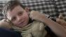 Wesley Sykes, 9, autistic, watches television on the couch of the familys home in Richmond, Va.
