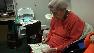Alzheimers patient helps with clinical trial.