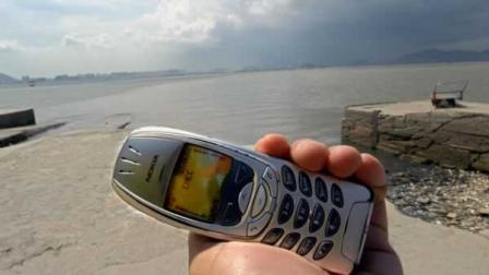 This mobile phone is being held in Hong Kongs outlying village of Lau Fau Shan Sunday, June 27, 2004,.