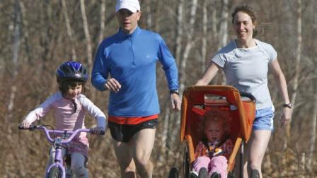In this April 24, 2009 file photo, Heidi Hill, runs with her husband and daughters