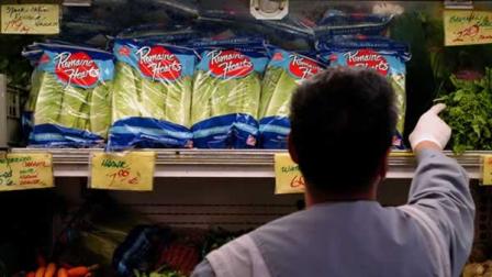 An unidentified produce employee restocks the shelf of bagged lettuce at a grocery store in Berkeley, Calif. on Wednesday, Sept. 20, 2006. (AP Photo/Benjamin Sklar)