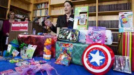 Jenny Levin, of U.S. PIRG Public Health Advocate, speaks during a news conference in Washington, Tuesday, Nov. 26, 2013, displaying a toy Captain America shield, right, together with others considered dangerous toys, according to U.S. PIRGs 28th annual Trouble in Toyland report. Several toys with high lead levels or toys that could cause young children to choke were found at major retailers and discount stores in the last few months, the U.S. Public Interest Research Group said Tuesday. The consumer safety group analyzed 50 toys for its annual report. Violations were found in just under a dozen, including a Captain America toy shield and play jewelry. (AP Photo/Manuel Balce Ceneta)