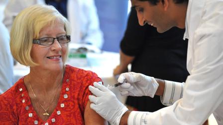 IMAGE DISTRIBUTED FOR FLU + YOU - Joyce Perry, age 65 of Jacksonville, Fla., receives her flu shot during the Flu + You clinic sponsored by the National Council on Aging and Sanofi Pasteur on Friday, Sept. 6, 2013