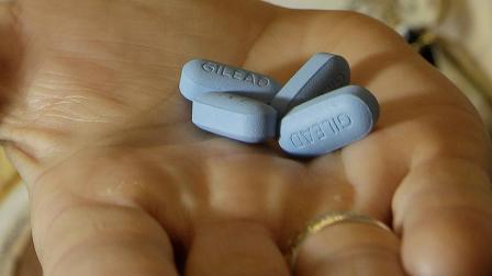 Dr. Lisa Sterman holds Truvada pills at her office in San Francisco, Thursday, May 10, 2012