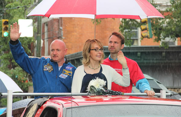 Former U.S. Rep. Gabrielle Giffords and husband,...