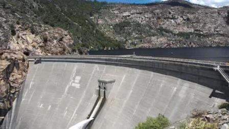 This is a June 2004 file photo of OShaughnessy Dam in the Hetch Hetchy reservoir in Yosemite National Park, Calif.(AP Photo/Environmental Defense, Tim Connor)