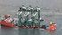 A ship carrying three new container cranes...