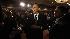 President Barack Obama reaches to shake hands...