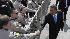 President Barack Obama shakes hands with members...
