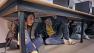 Academy of Art University students Lisa Allen, left, and Shaofu Zhang, right, take part in the California ShakeOut - a statewide Drop, Cover and Hold earthquake drill in San Francisco, Thursday Oct. 15, 2009.