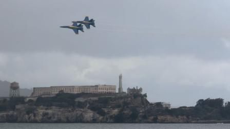 Members of the U.S. Navy Blue Angels fly over Alcatraz Island during practice in San Francisco, Thursday, Oct. 6, 2011.